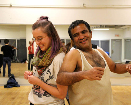 two people dancing and smiling